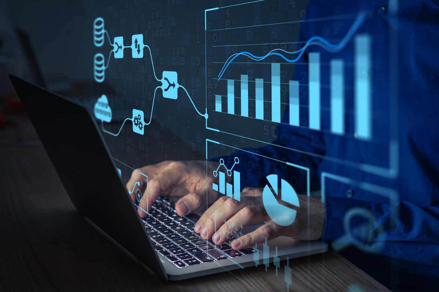 Person working on laptop with data charts.