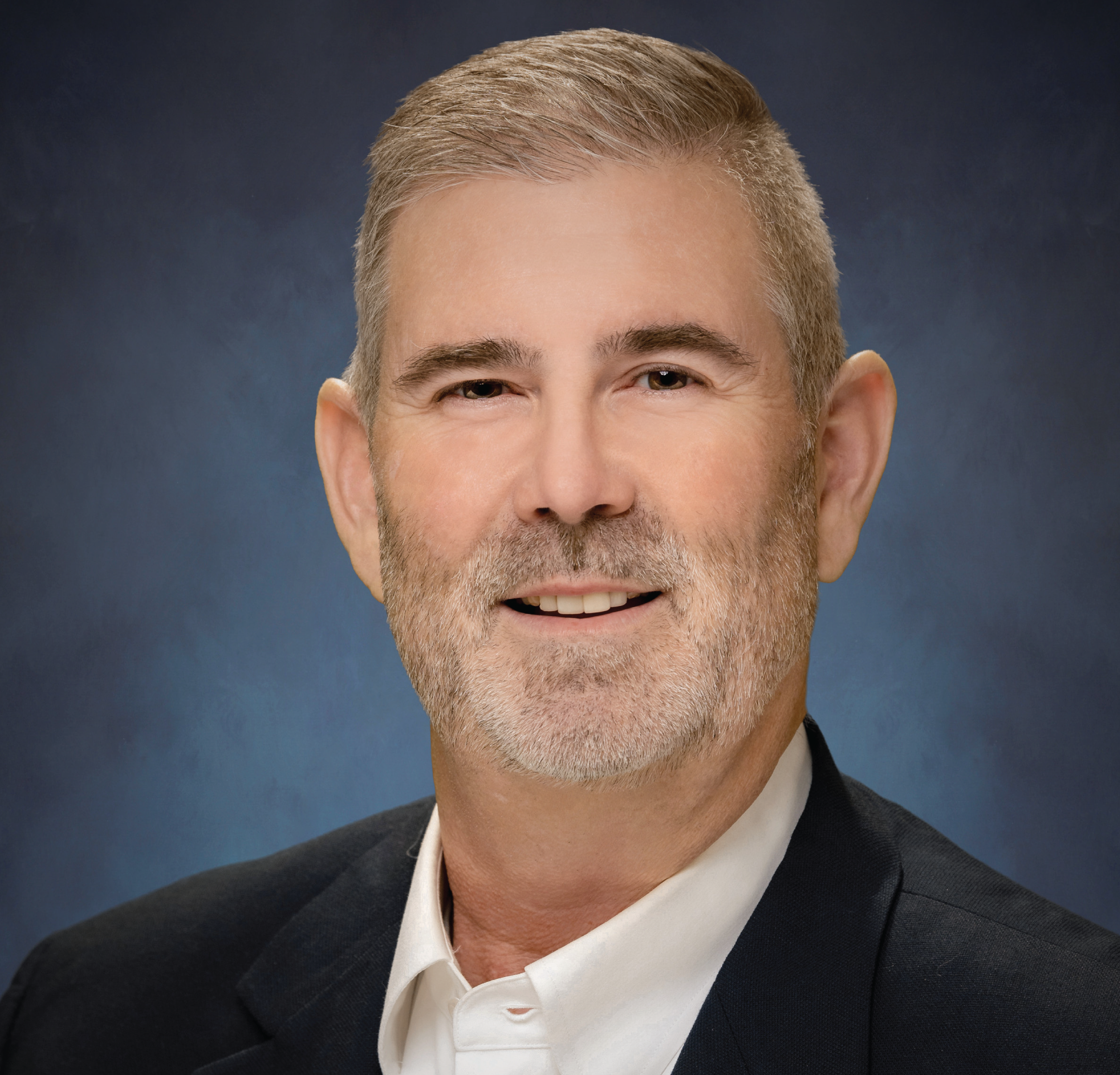 Smiling mature man in business suit.